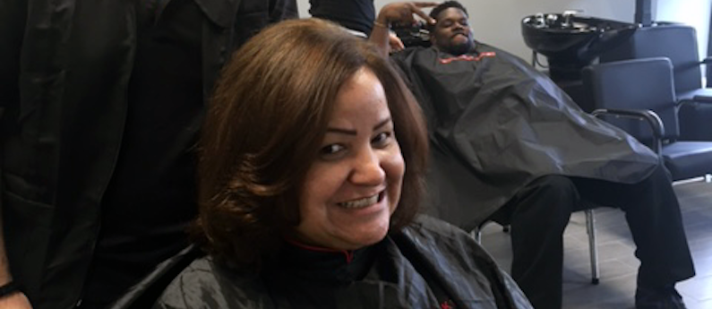 Woman smiling in a salon.