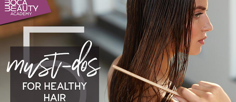 Woman brushing her hair with a wet comb.