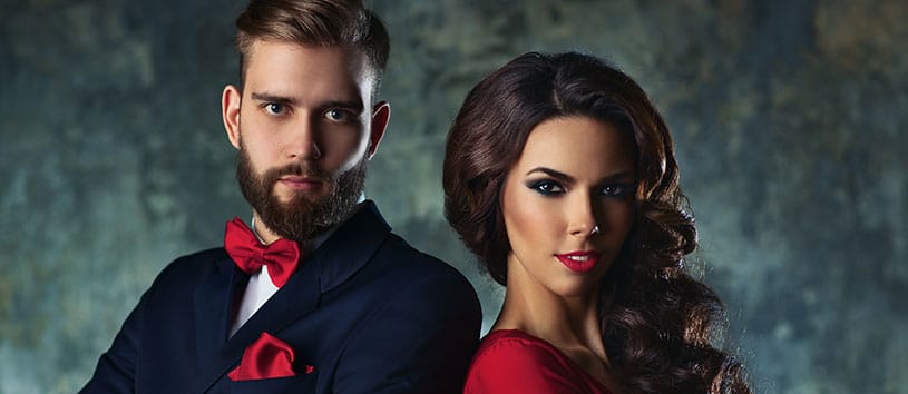Man and woman standing together looking fierce.